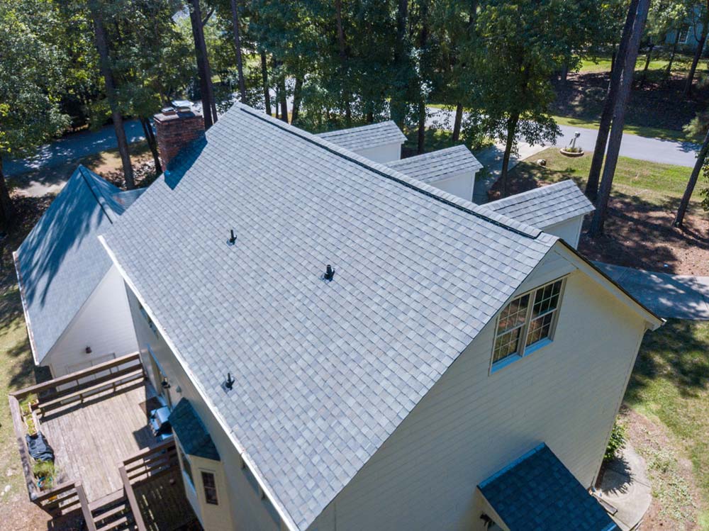 Aerial view of a home with gray asphalt shingles