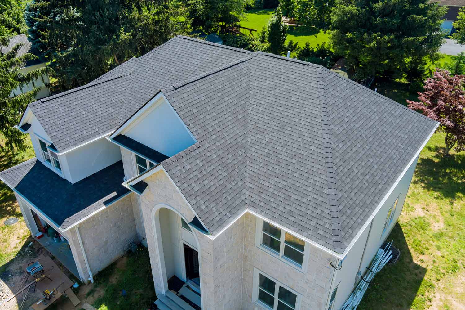 Aerial view of a home with gray asphalt shingles
