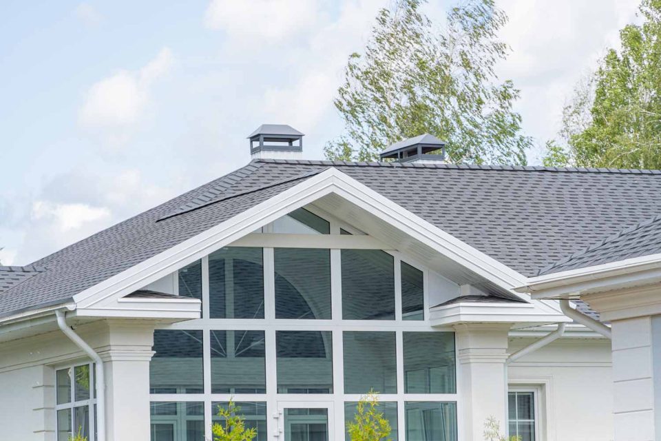 White home with gray asphalt shingles