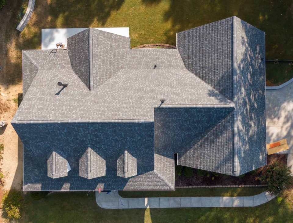 Aerial view of a home with gray asphalt shingles