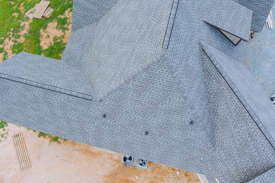 Aerial view of a home with gray asphalt shingles